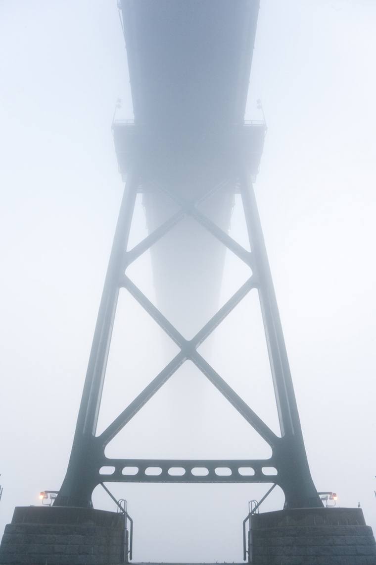 Vancouver photography of the underside of a bridge in the fog.
