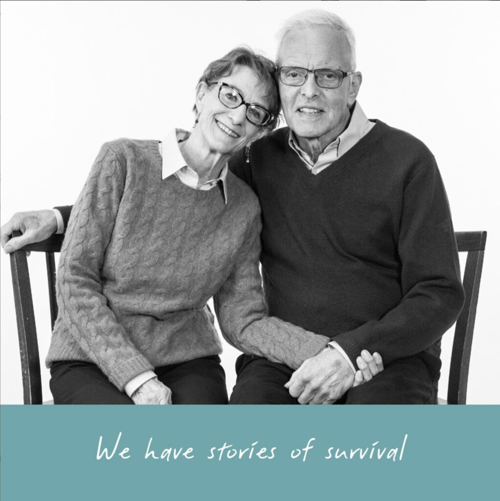 Final image for ALZBC holiday campaign. Elderly couple seated while holding hands and smiling.